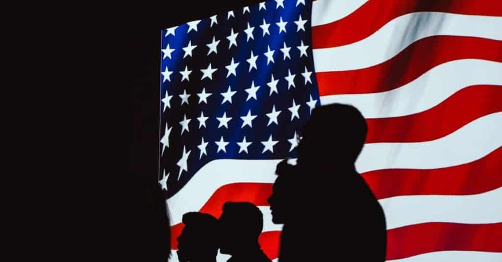 silhouettes against flag