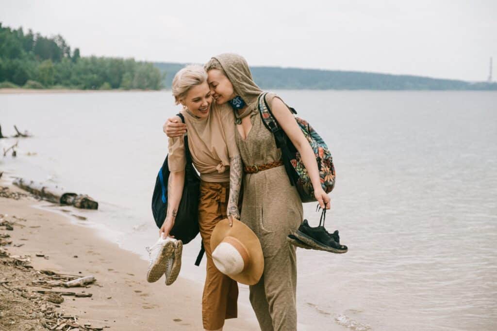 Women hugging on the beach reunited detained by ICE